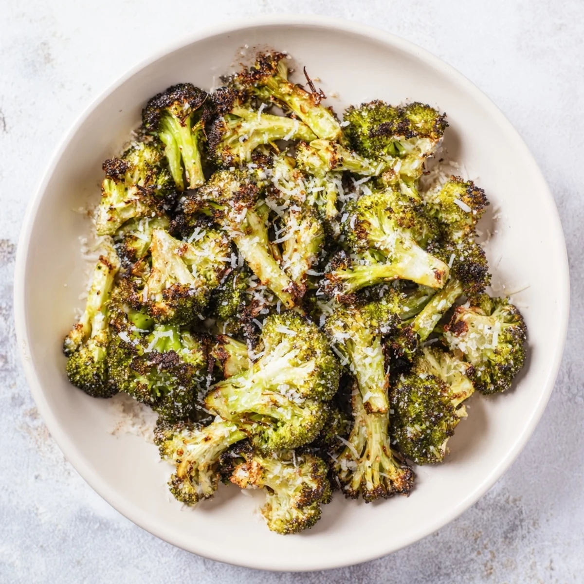 Savory Simple Garlic and Parmesan Roasted Broccoli, a delicious vegetarian side, fresh from the oven, ready to enjoy.