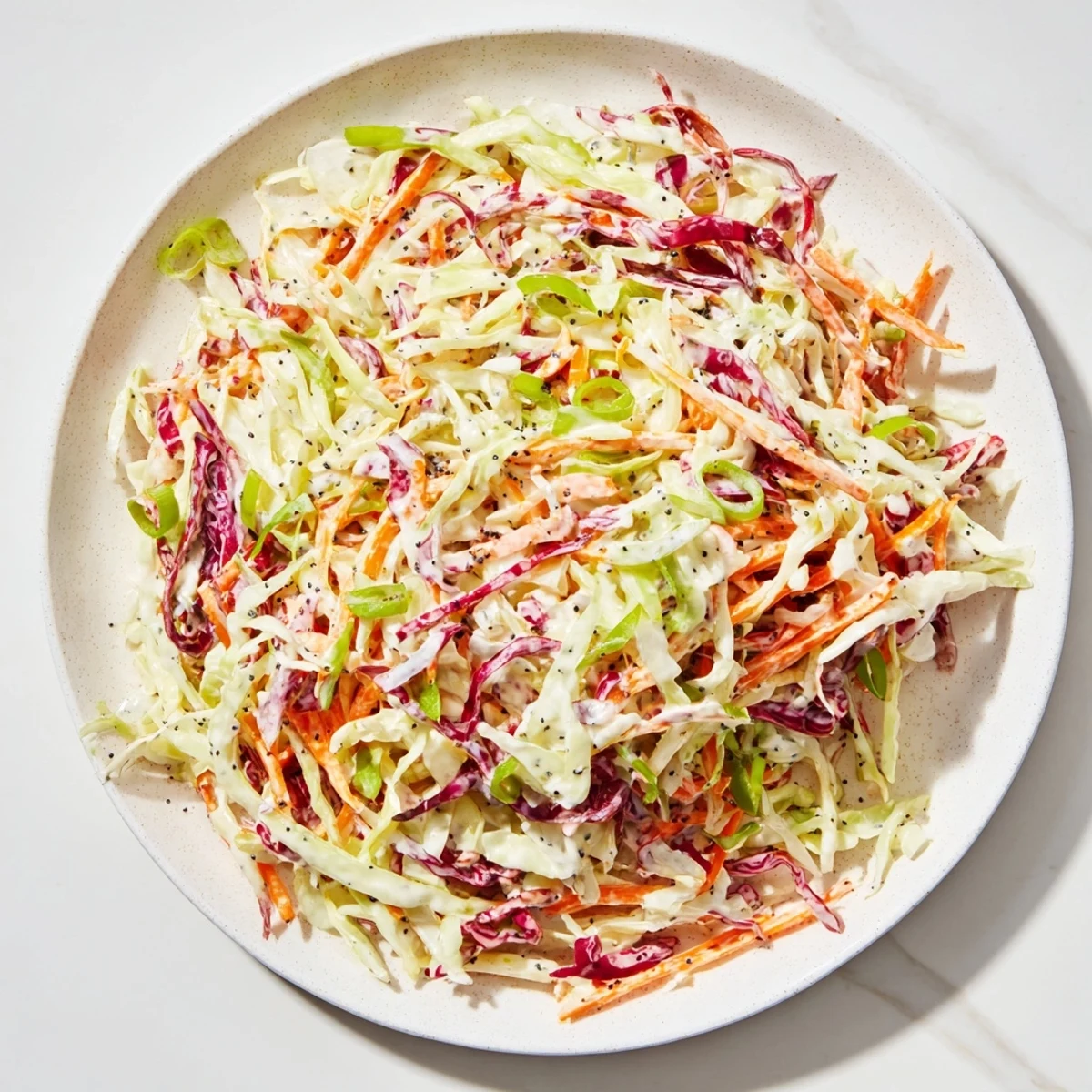 Enjoy a colorful bowl of Quick Coleslaw Salad, the perfect cool and crunchy addition to any BBQ.