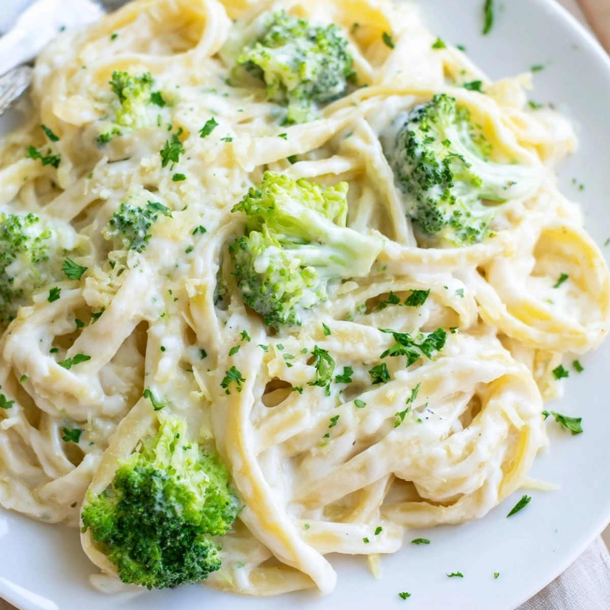 Creamy cream cheese garlic pasta tossed with broccoli, a comforting vegetarian dinner.