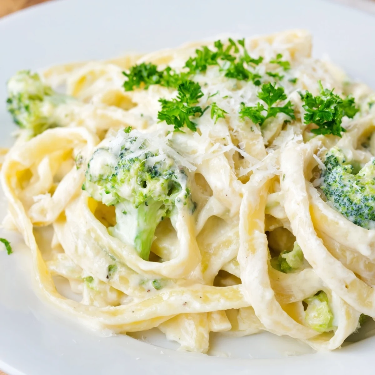 A close-up of the delicious cream cheese garlic pasta, garnished with fresh parsley and Parmesan.