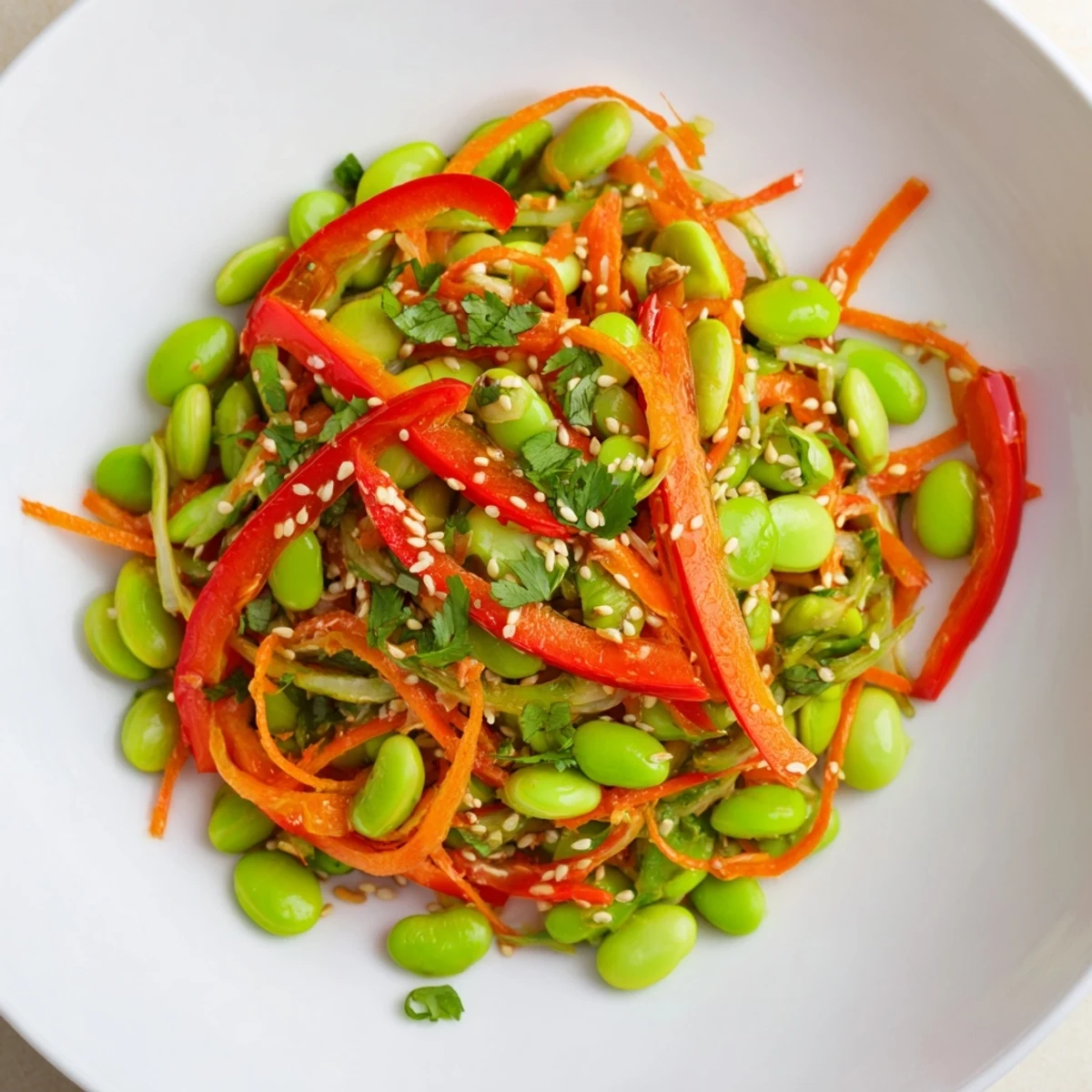 A colorful serving of Asian edamame salad with toasted sesame seeds, perfect for a fresh lunch.