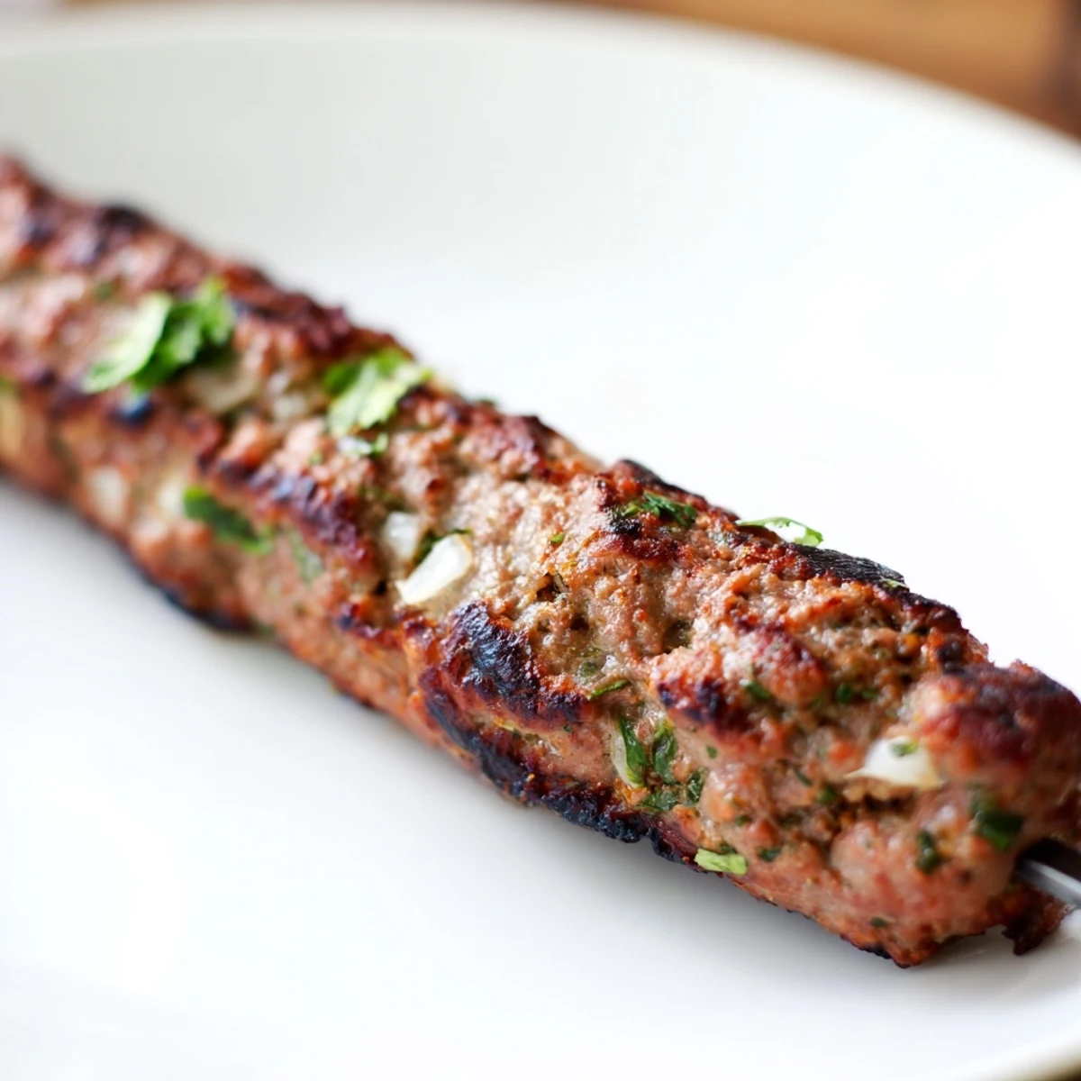 Smoky and flavorful Iraqi Kebab Tikka skewers, grilled to perfection, ready to serve with fresh garnishes.