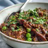 A rustic bowl of Venison Keema Curry highlights tender ground meat and aromatic spices.