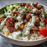 Delicious, flavorful Middle Eastern Shawarma Bowl drizzled with creamy tahini sauce.