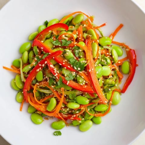A colorful serving of Asian edamame salad with toasted sesame seeds, perfect for a fresh lunch.