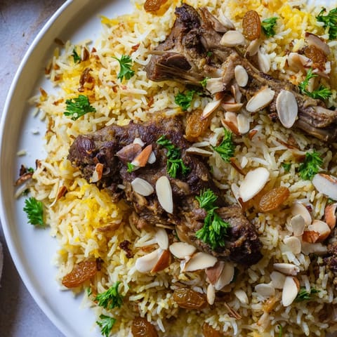 Steaming Saudi Kabsa Rice features fluffy basmati, tender meat, and aromatic spices cooked perfectly.