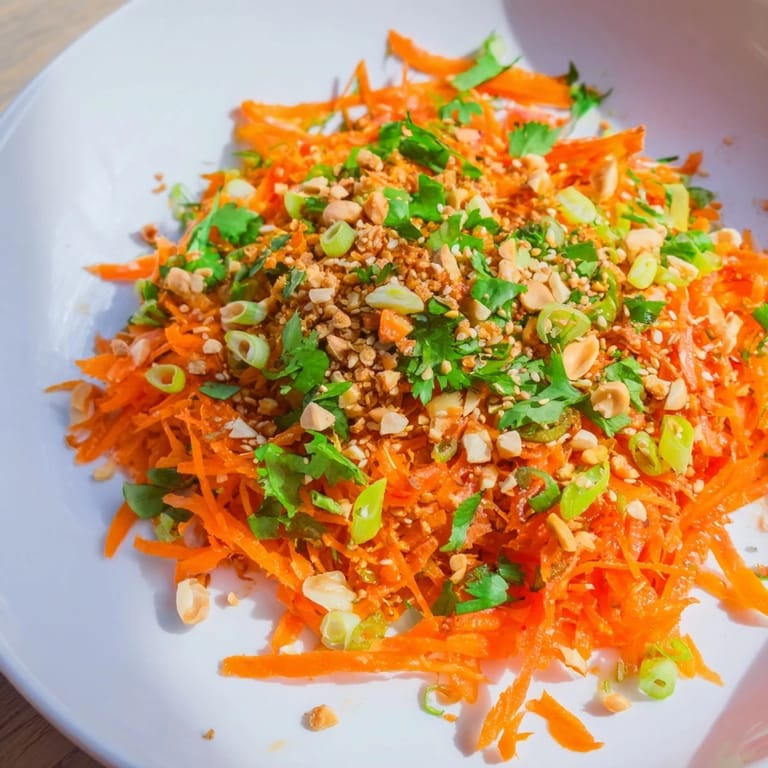 A bowl of delicious Spicy Carrot Salad, perfect served as a flavorful, refreshing side dish.
