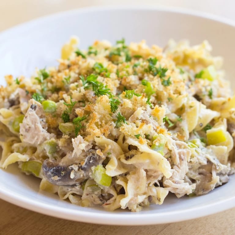 Creamy homemade Tuna Noodle Casserole 2.0 with tender noodles and juicy tuna, bubbling from the oven.