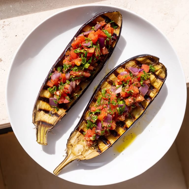 Steaming hot Imam Bayildi, with tender eggplant and a rich tomato-based filling, ready to serve.